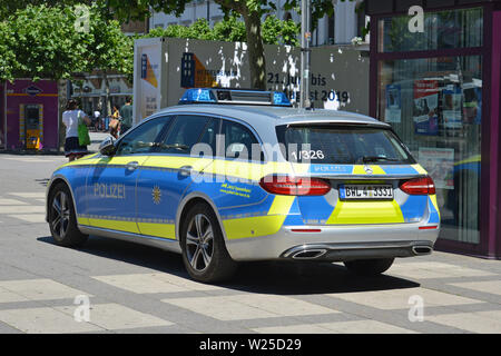 Heidelberg, Germany - June 19th: Blue and yellow german police car parked on square in inner city Stock Photo