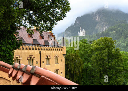 BAVARIA, GERMANY - JUL 2017: View of the Royal castles among the forested mountains in the Bavarian Alps Stock Photo