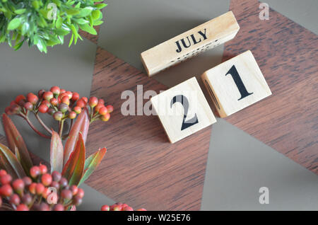 Date of July month. Diamond wood table for background. Stock Photo