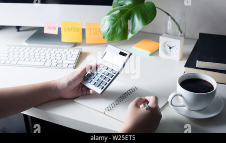People working with calculator on worktable office. business plan, financial concepts Stock Photo