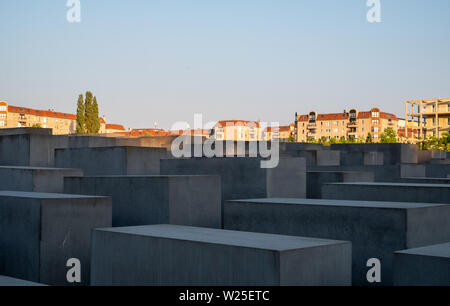 Concrete slabs at the Memorial to the Murdered Jews of Europe, designed by Peter Eisenman. The memorial is photographed in the late afternoon sun. Stock Photo