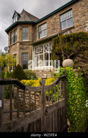 UK, Cumbria, Sedbergh, Joss Lane, wooden garden gate of substantial three storey stone-built Victorian house Stock Photo