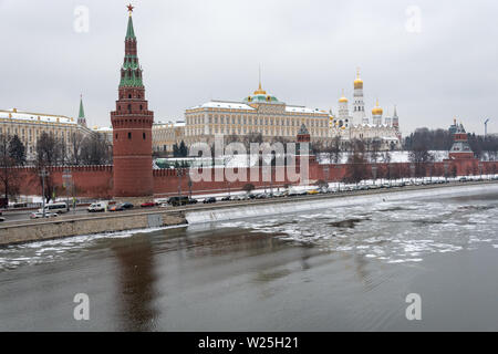 View of the winter Kremlin and the dome of the churches on the banks of the freezing river. Stock Photo
