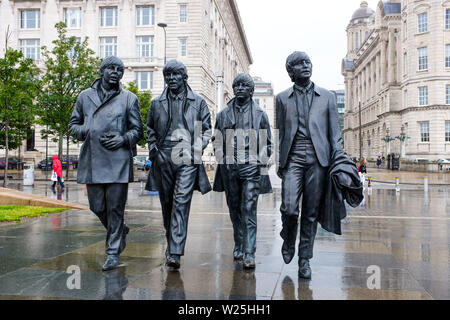 Liverpool Merseyside UK - Beatles bronze statues of the four Beatles Paul McCartney , George Harrison , Ringo Starr and John Lennon Stock Photo