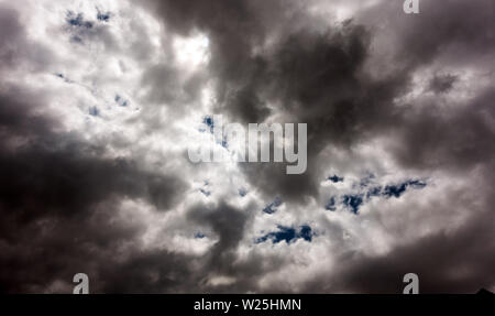 Dark and Dramatic Storm Clouds Area Background Stock Photo