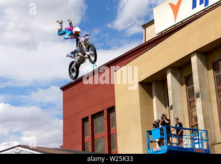 Stunt Fighters show. Rider shows amazing handlebar tricks. Stock Photo