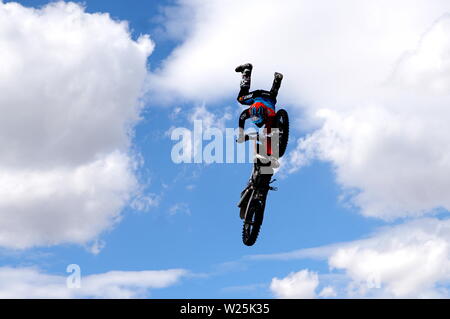 Stunt Fighters show. Rider shows amazing handlebar tricks. Stock Photo