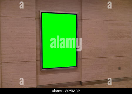 Wall with light display ad board - green color advertisement mock up Stock Photo