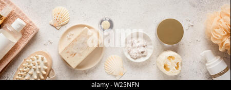 Bath Accessories on white stone background, top view, banner. Daily bodycare concept, organic bath products. Stock Photo