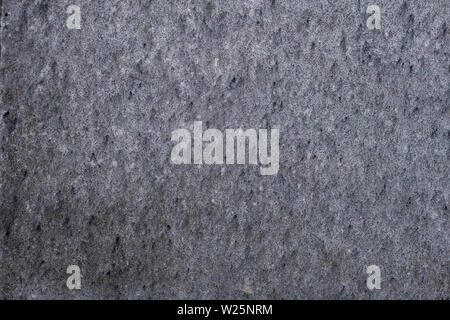 gray gruge wall surface with an attractive texture. plastered wall. Stock Photo