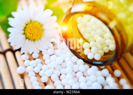 Globules and flower, homeopathic medicine Stock Photo