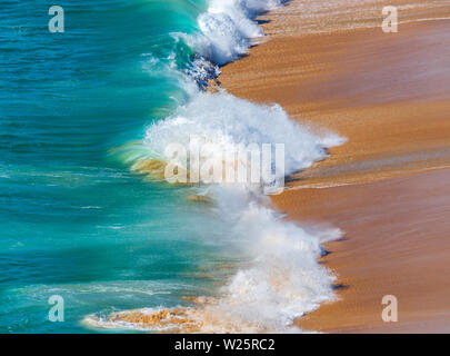 Soft blue ocean wave on sandy beach. Background. Stock Photo