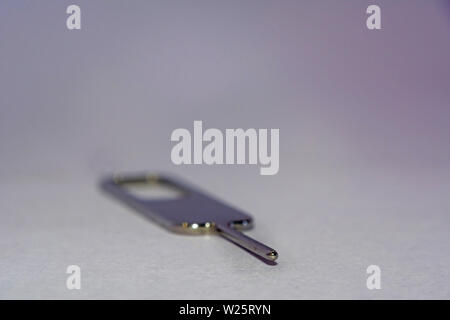 close up of Nano sim card ejector on white background Stock Photo