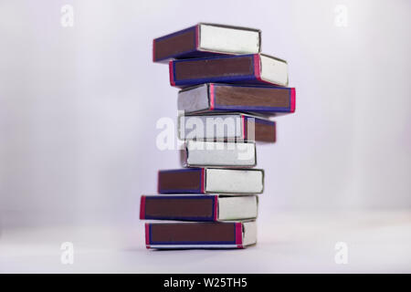 Match boxes arranged in stack isolated from white background Stock Photo