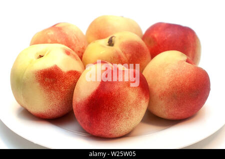 Fresh nectarines isolated on white background Stock Photo