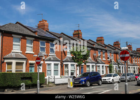 One house with a solar panel in a row of Victorian terraced houses in Cheltenham UK Stock Photo