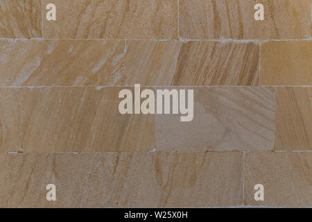 The texture of the wall lined with stone slabs Stock Photo