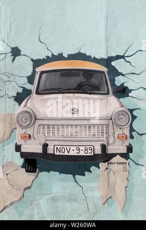 Berlin, Germany - September 9, 2014: Painting from Birgit Kinder of a Trabant in The East Side Gallery, Berlin Wall