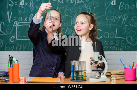 Knowledge crossroads molecular biology and chemistry. School project investigation. School experiment. Science concept. Private school. Gymnasium students with in depth study of natural sciences. Stock Photo