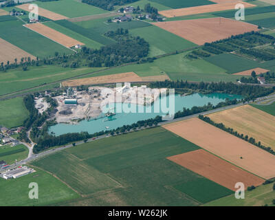 Gravel Pit with Pond - Aerial View - Commercial Gravel and Sand Quarry - Gravel Industry Stock Photo