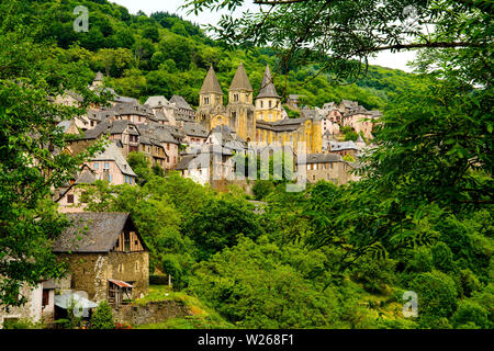 View of Conques village and abbey-church of Sainte-Foy the jewel of Romanesque art, Occitanie, France. Stock Photo