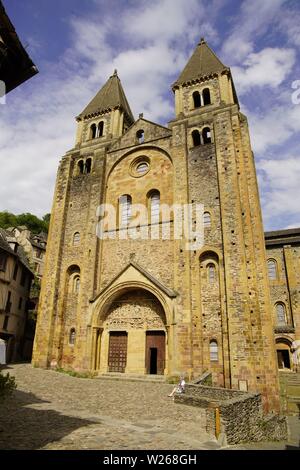West-facade and Last Judgment Tympanum, abbey- church of Sainte-Foy, Conques, Occitanie, France. Stock Photo