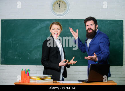 Time to chill. paper work. office life. teacher and student on exam. back to school. Non-formal education. business couple use laptop and document. businessman and secretary. Enjoying time in college. Stock Photo