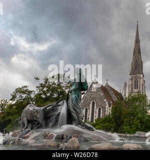 A view of St Alban's Church in Copenhagen and the Gefion fountain. The church is sometimes known as The English Church Stock Photo