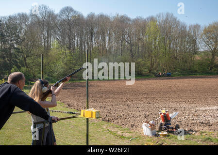 Woman/lady  at a clay pigeon shoot Stock Photo