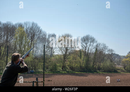 Man aiming  at a clay pigeon shoot Stock Photo