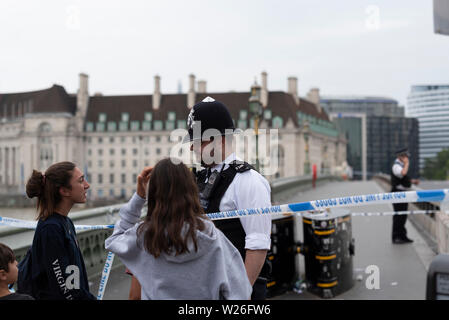 Police have closed Westminster Bridge to vehicle and pedestrian traffic after it was hit by a City Cruises vessel on the River Thames around 16:30. Fire brigade also in attendance. The bridge will remain closed until it has been inspected and declared safe. Officer at cordon with members of the public
