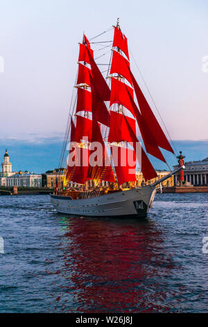 Ship with red sails sails on the Neva. Preparation for the holiday of all schoolchildren 'Scarlet Sails' in St. Petersburg Stock Photo