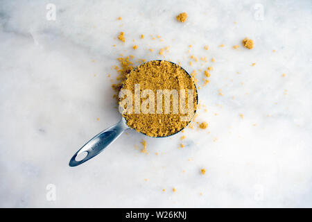 Packed Brown Sugar in a Measuring Cup Stock Photo