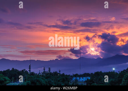 Swilight sunset sky clouds with forest Stock Photo