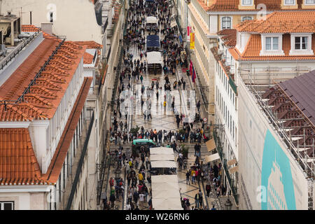 Aerial view from the Arco da Rua Augusta of the pedestrianised commercial street of Rua Augusta, in Lisbon, Portugal busy with shoppers and tourists. Stock Photo