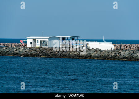 white buildings of the marine science center on the pier in warnemuende germany Stock Photo