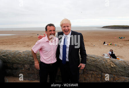 Conservative Party leadership candidate Boris Johnson with Welsh Secretary Alun Cairns during a visit to Barry Island, in South Wales. Stock Photo
