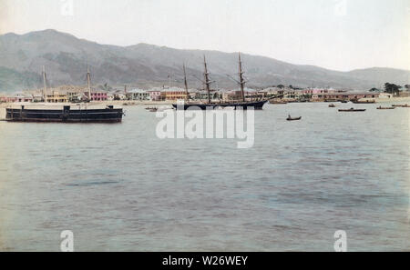 [ 1880s Japan - Kobe Harbor ] —   Ships in Kobe Port. In the background the stately houses on the Bund can be seen.  19th century vintage albumen photograph. Stock Photo