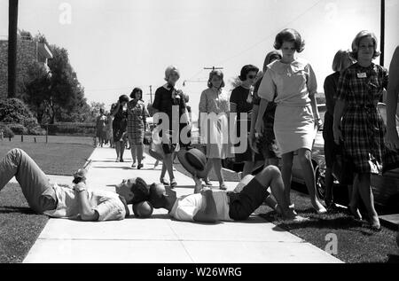 Male students teasing Female students arriving on freshers day at University of Southern California Sorority, USA 1964 Stock Photo