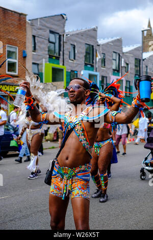 A man performs in the parade at St Pauls Carnival, Bristol, 6 July 2019 Stock Photo