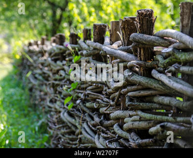 fence wicker from the vine in the countryside Stock Photo