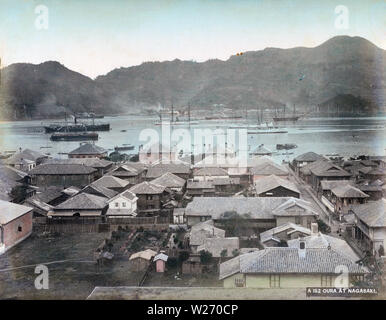 [ 1880s Japan - Oura Foreign Settlement, Nagasaki ] —   Large ships in Nagasaki Harbor and western-style houses in the Oura Foreign Settlement in Nagasaki, ca. 1887.  19th century vintage albumen photograph. Stock Photo