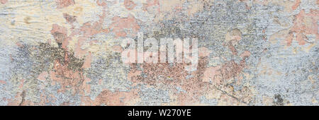 Textured grunge background. Old plastered wall with a multilayer cracked coating. Grunge texture with a deep pattern on the wall Stock Photo