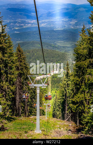 Dobrinishte, Bulgaria - May 28, 2016: Mountain spring, summer landscape with Dobrinishte chair lift near Bansko Stock Photo