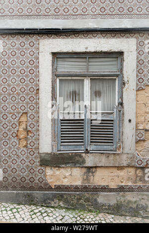 Gray window shutters and grunge wall background Stock Photo