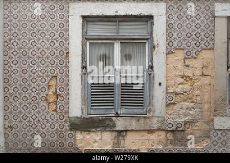 Gray window shutters and grunge wall background Stock Photo