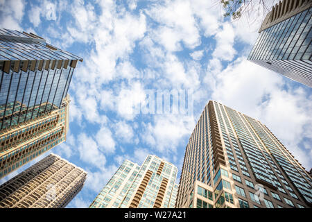 Chicago, Illinois. USA, Cityscape, spring day. City high rise buildings blue cloudy sky background, low angle view