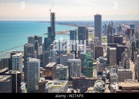 Chicago cityscape aerial view, spring day. High rise buildings and lake Michiganl, blue sky background. High angle view from skydeck Stock Photo