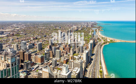 Chicago cityscape aerial view, spring day. High rise buildings and lake Michiganl, blue sky background. High angle view from skydeck Stock Photo
