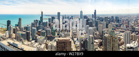 Chicago panorama. Cityscape aerial view, spring day. High rise buildings and lake Michiganl, blue sky background. High angle panoramic view from skyde Stock Photo